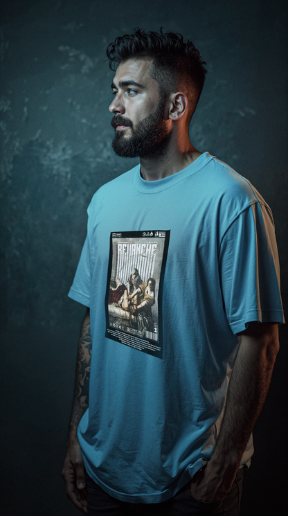 Homme barbu portant le t-shirt REVANCHE bleu oversize avec imprimé graphique, vue de profil