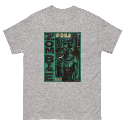 T-shirt gris de face sur fond blanc Illustration style rétro gaming inspirée des boîtes Sega : un zombie torse nu aux yeux jaunes lumineux, éclairé en néon vert, sur fond blanc. Le mot ZOMBIE s'affiche verticalement à gauche, avec le logo SEGA HAÏTI en haut au centre.